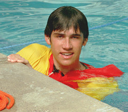 lifeguard in pool wearing an anorak